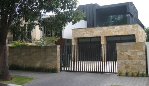 Quarry Face Sandstone House with matching fence
